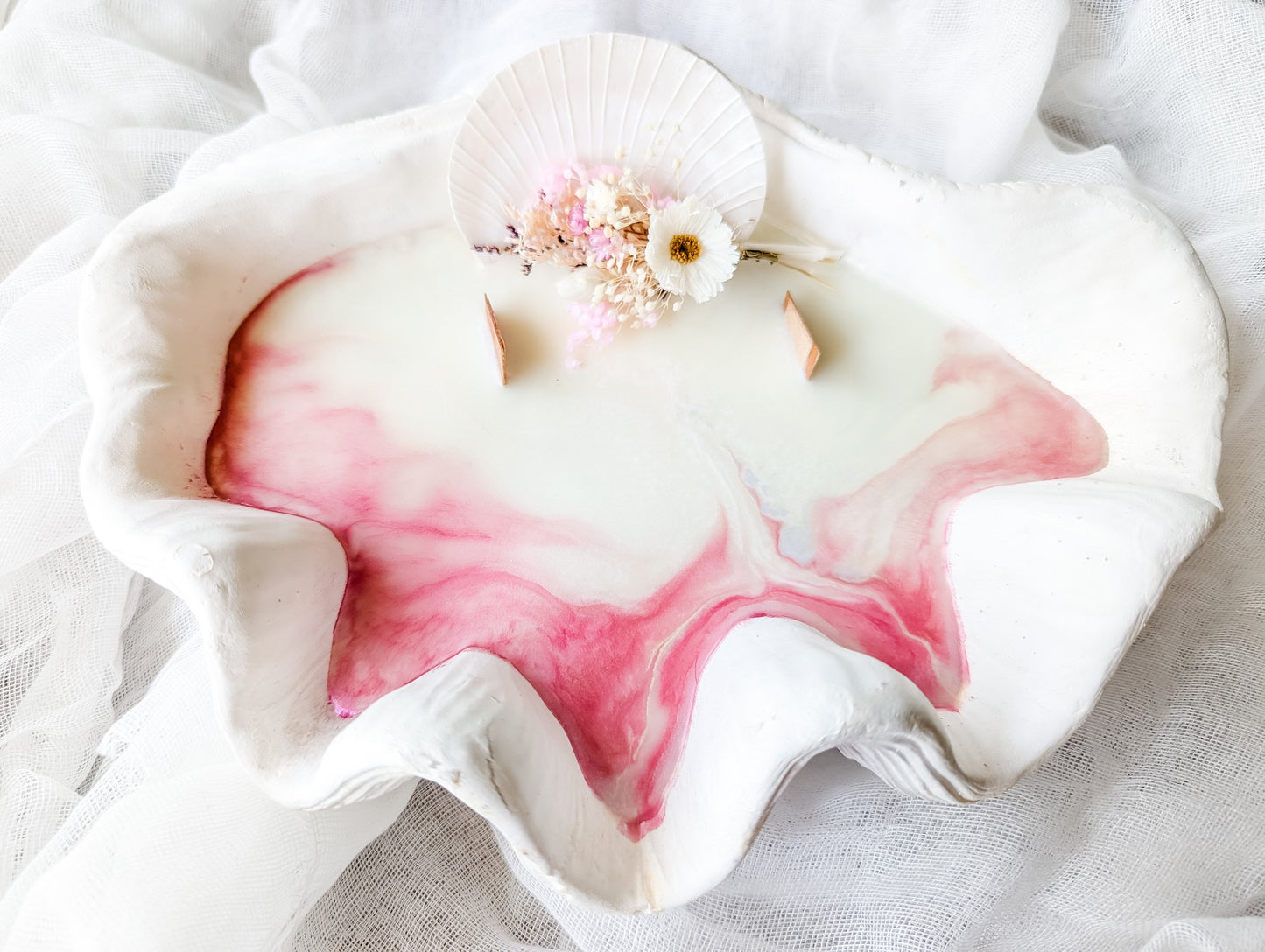pink-shell-candle-ocean